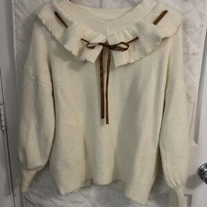 Cream Ruffled Sweater with Brown Accents